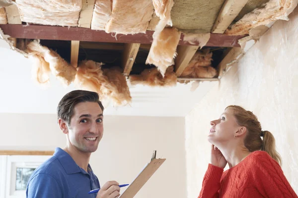 Builder And Customer Discussing Ceiling Repair — Stock Photo, Image