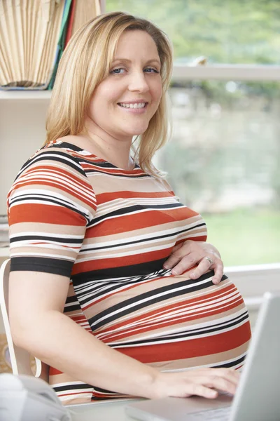 Happy Pregnant Woman Sitting At Desk In Home Office — Stock Photo, Image