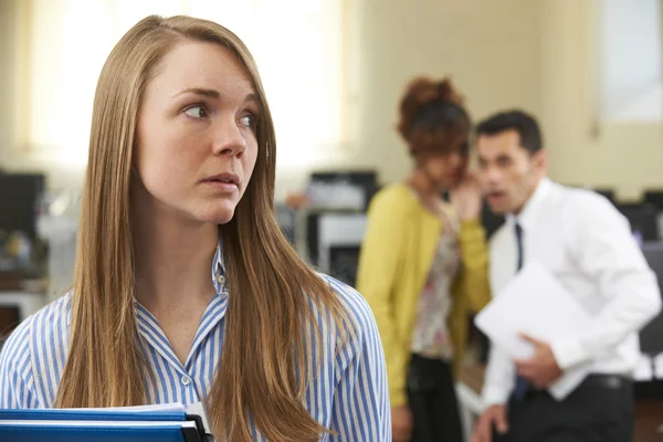 Businesswoman Being Gossiped About By Colleagues In Office — Stock Photo, Image