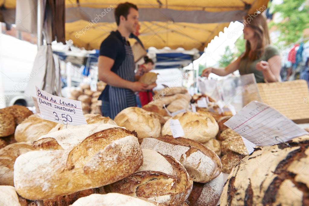 Fresh Bread For Sale On Market Stall — Stock Photo © HighwayStarz 92824960
