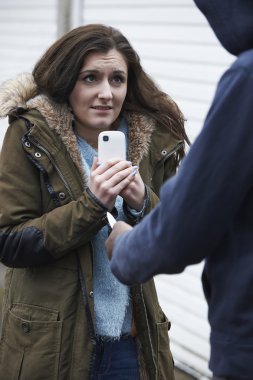 Teenage Girl Being Mugged For Mobile Phone clipart