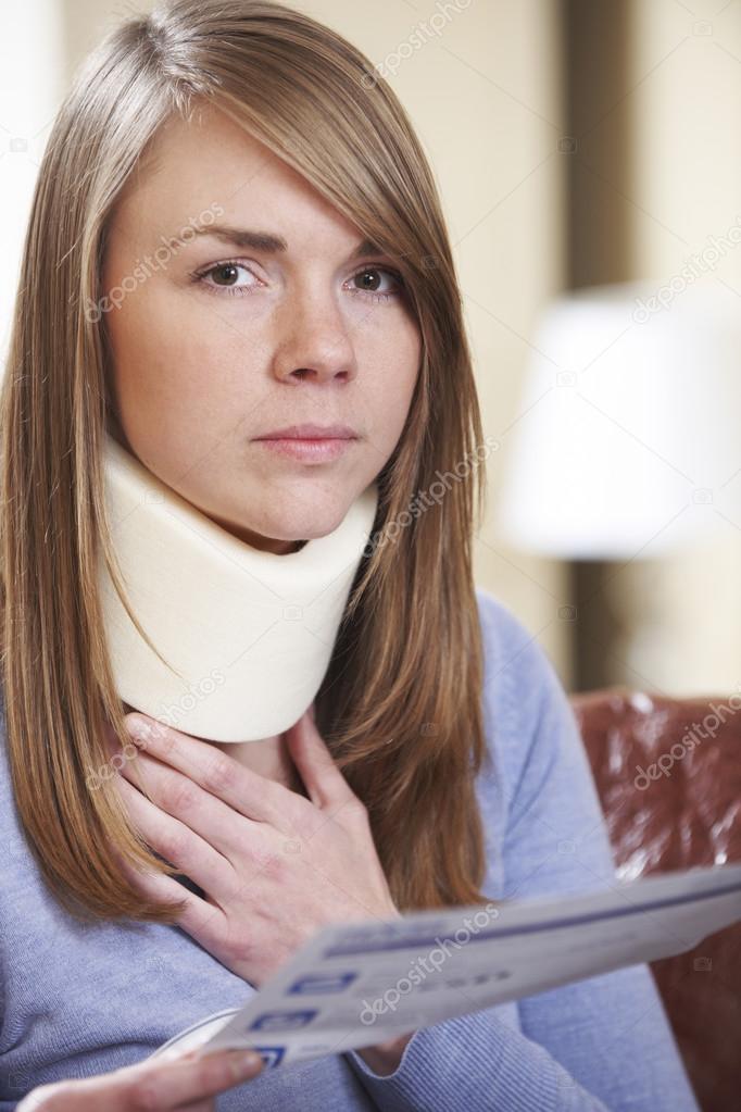 Young Woman Wearing Neck Brace Reading Letter