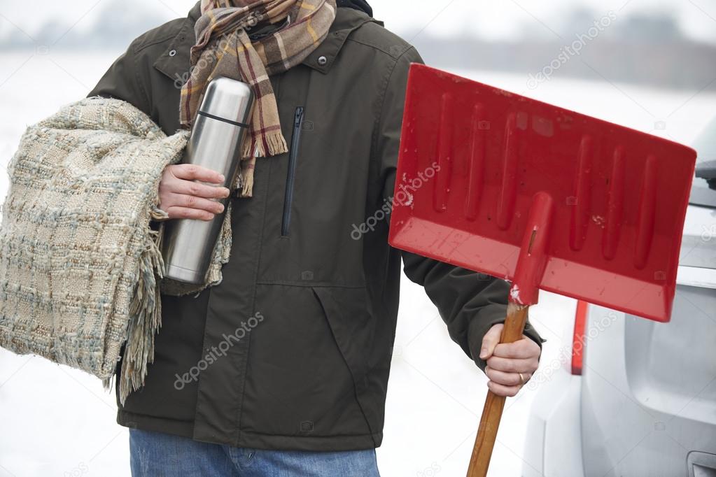 Motorist Holding Blanket And Thermos In Case Of Winter Breakdown