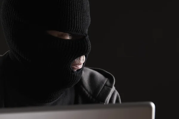 Masked Criminal Accessing Computer Data — Stock Photo, Image