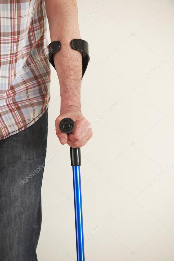 Close Up Of Man Using Crutches
