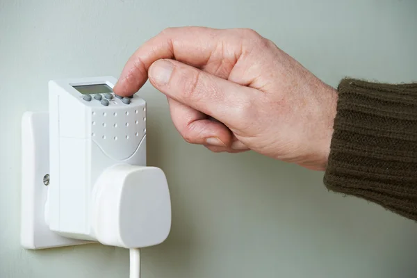 Close Up Of Hand Adjusting Timer Switch In Plug Socket — Stock Photo, Image