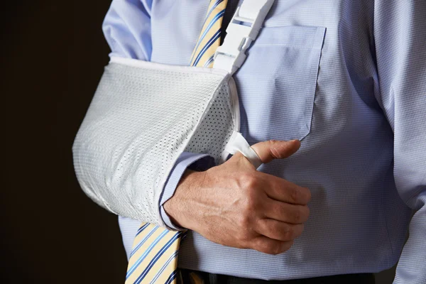 Close Up Of Businessman With Arm In Sling Stock Picture