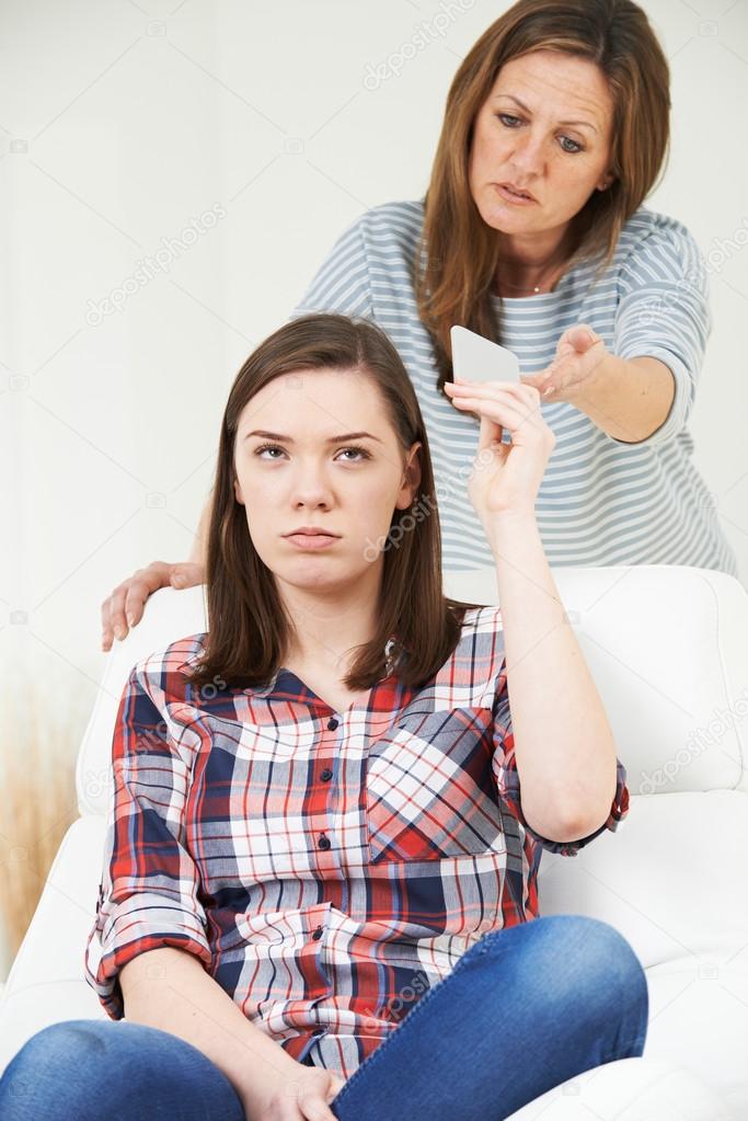 Mother Taking Mobile Phone Away From Teenage Daughter — Stock Photo