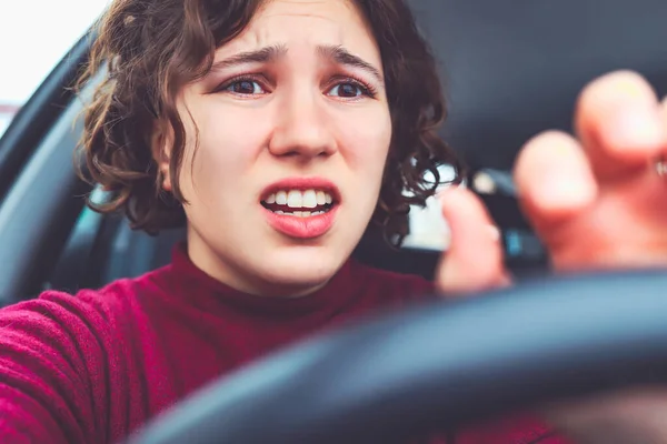 Sad portrait of pretty girl driving car. Upset face. — Stock Photo, Image