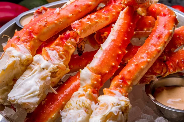 King crab claws on wooden table