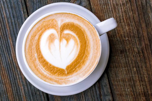 Cappuccino coffee with heart drawing