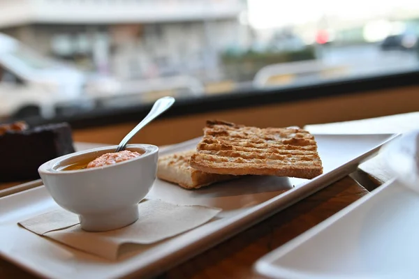 Toasted bread with tomato. Toast with crushed tomato. Delicious continental breakfast. Breakfast of toast with tomato, coffee and orange juice.