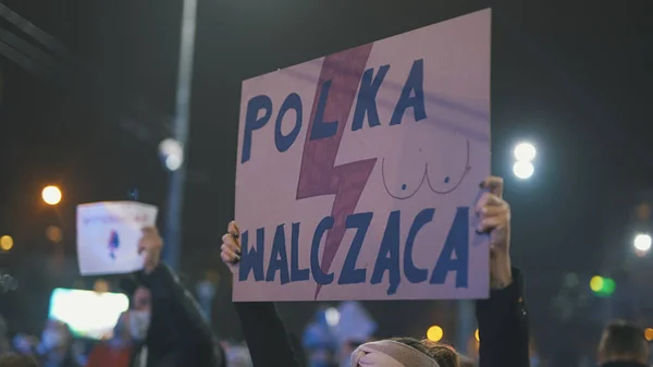 Warsaw, Poland 23.10.2020 - Protest against Polands abortion laws. Poland is fighting banner in crowd — Stock Photo, Image