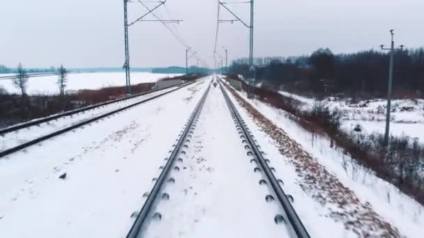 Ponto de vista do trem na ferrovia coberta de neve — Vídeo de Stock