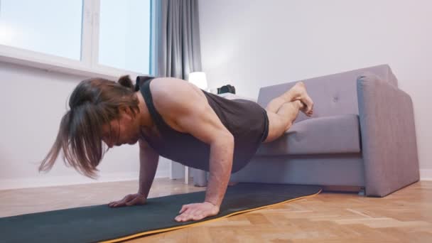 Healthy lifestyle. Young handsome caucasian man doing push ups in his bedroom. Healthy lifestyle — Stock Video