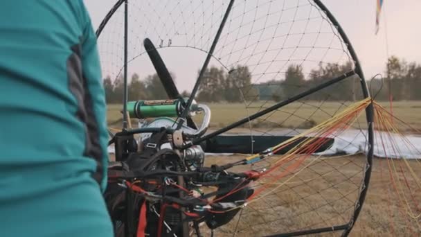 Engine with propeller and unpacked parachute prepared for check — Stock Video