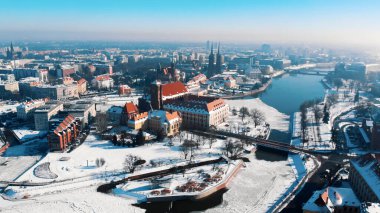Snow-covered streets in the city of Wroclaw, Poland. Winter season. Old town and buildings. City skyline