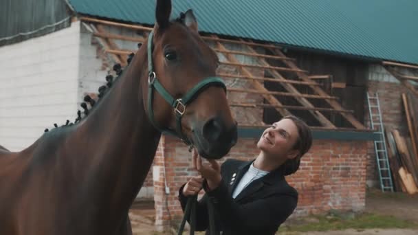 Female Horse Owner Touching A Seal Brown Horse With Love Outside The Horse Stable — Stock Video