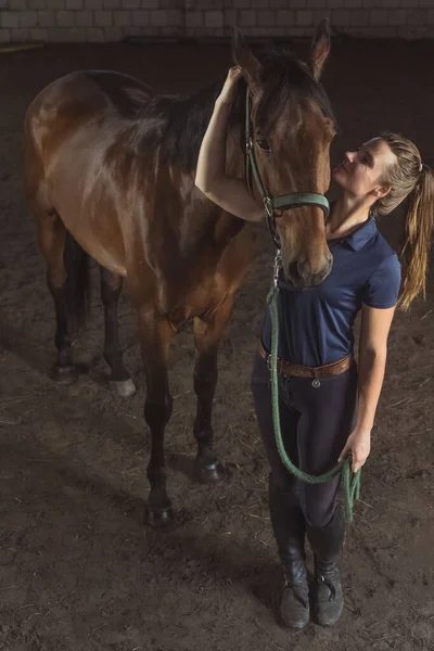 Horsewoman Embracing Her Seal Brown Horse In The Stable - Showing Her Love — Stock Photo, Image