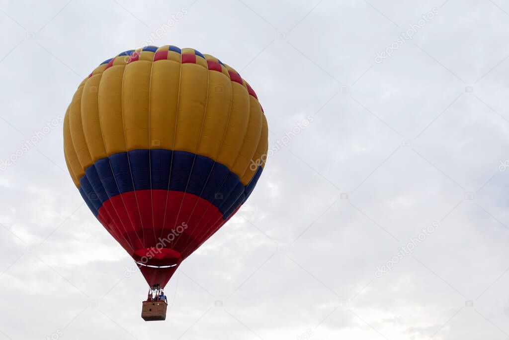 balloon against cloudy skies