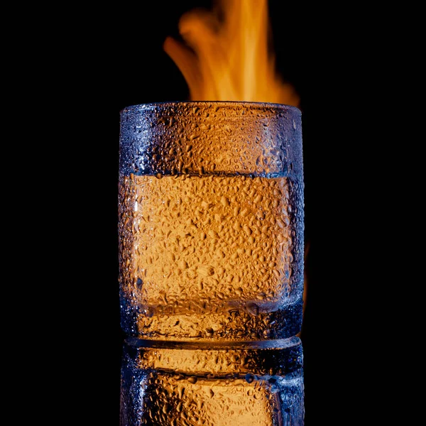 Fire and water and black background, place under the text — Stock Photo, Image