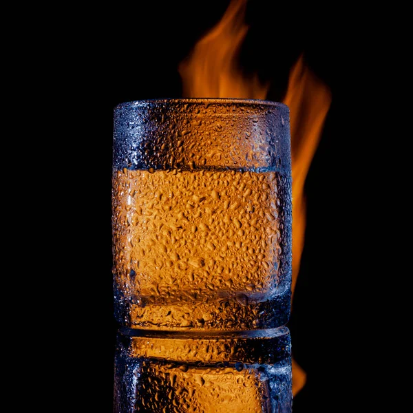 Fire and water and black background, place under the text — Stock Photo, Image