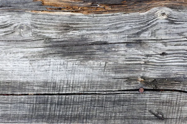 Staré shnilé šedé dřevěné prkno, používané jako pozadí nebo textura — Stock fotografie