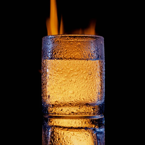 Fire and water and black background, place under the text — Stock Photo, Image