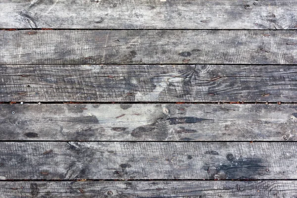 Staré dřevěné šedé desky, používané jako pozadí nebo textura — Stock fotografie