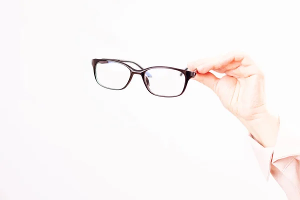 Problemas de visión, selección de gafas con dioptrías, fondo blanco — Foto de Stock