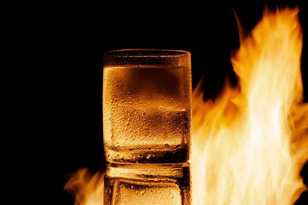 Fire and water and black background, place under the text Stock Picture