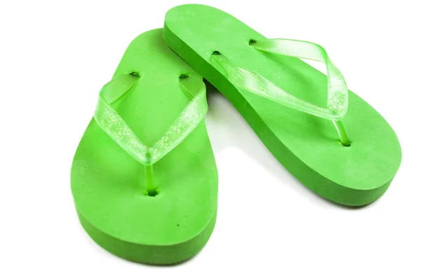 Green rubber beach flip flops on a white background, isolate — Stock Photo, Image