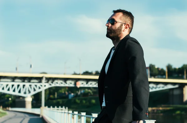 Handsome attractive bearded model man in urban context — Stock Photo, Image