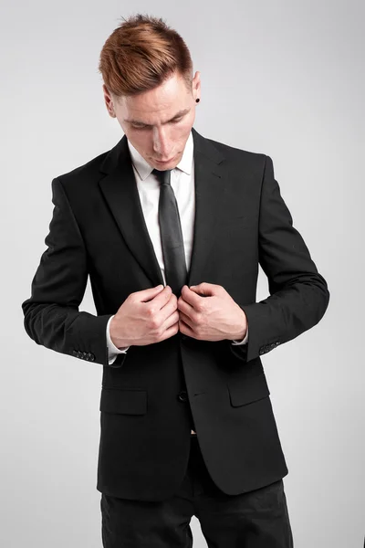 Young man in a black suit — Stock Photo, Image