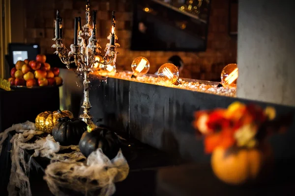 Melting candles and pumpkins — Stock Photo, Image