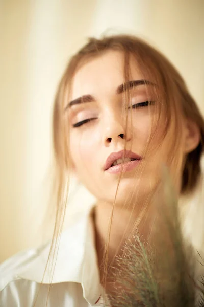 Young sensual woman in studio interior — Stock Photo, Image