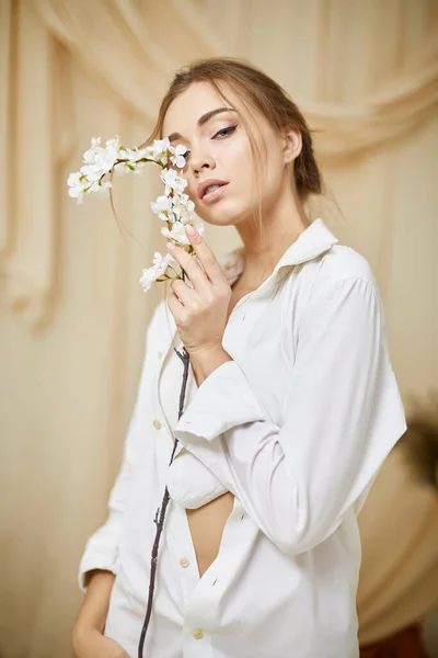 Young sensual woman in studio interior — Stock Photo, Image