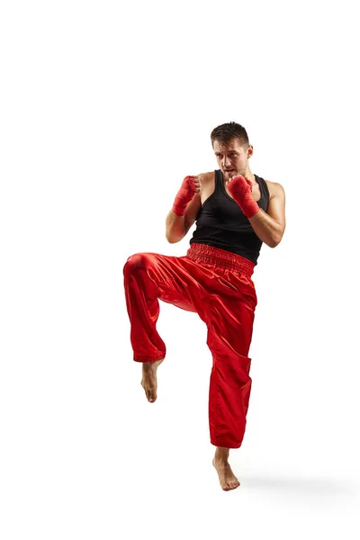 Sporty man in red sports bandages fighting — Stock Photo, Image