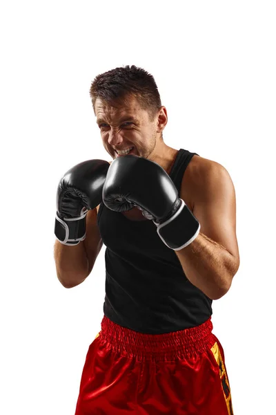 Hombre deportivo en guantes de boxeo negro puñetazos —  Fotos de Stock