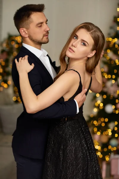 Beautiful couple dancing in the living room