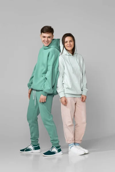 Young couple wearing mint green casual hoodie — Stock Photo, Image