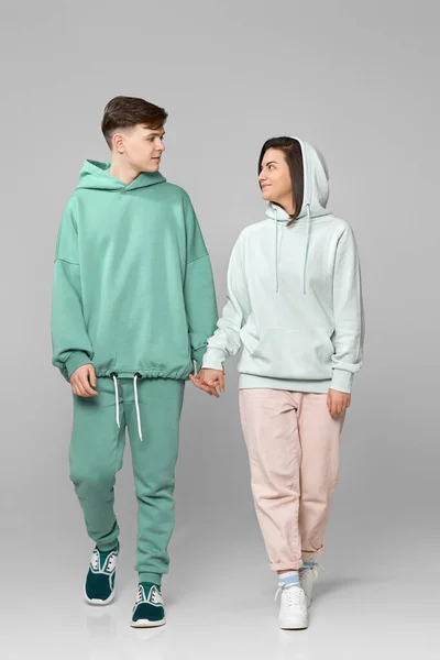 Young couple wearing mint green casual hoodie — Stock Photo, Image