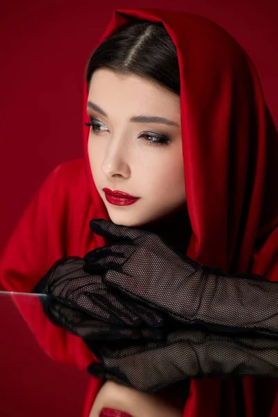 Brunette woman with red lips and veil over her head — Stock Photo, Image