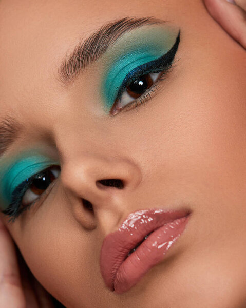 young woman with blue eye shadow makeup