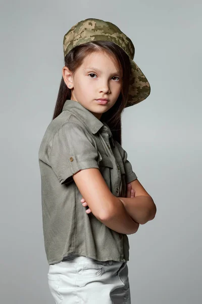 Child girl wear military uniform. kid dressed like a soldier — Stock Photo, Image