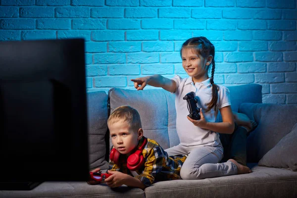 children playing video game with game console