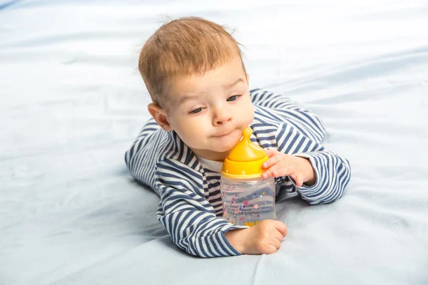 Baby and bottle — Stock Photo, Image