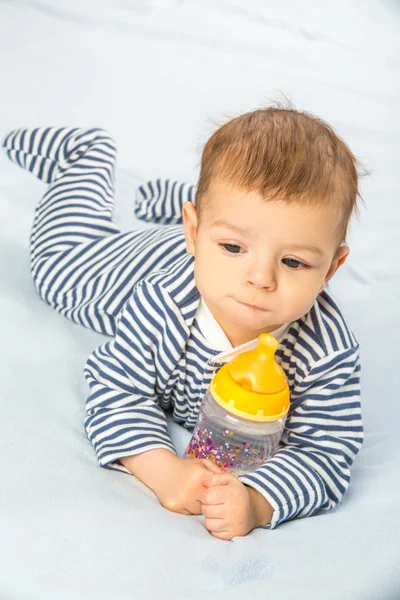 Baby and bottle — Stock Photo, Image