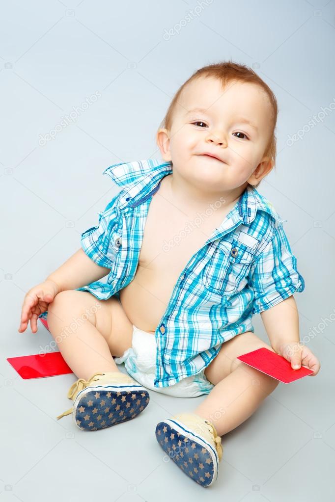 child holding card