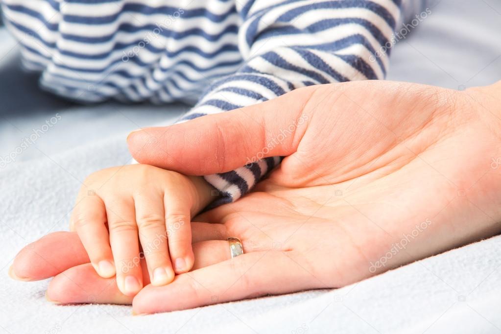 baby and mothers hands